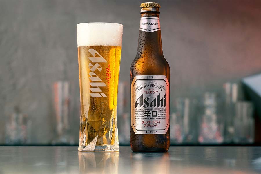 Asahi beer bottle and filled glass